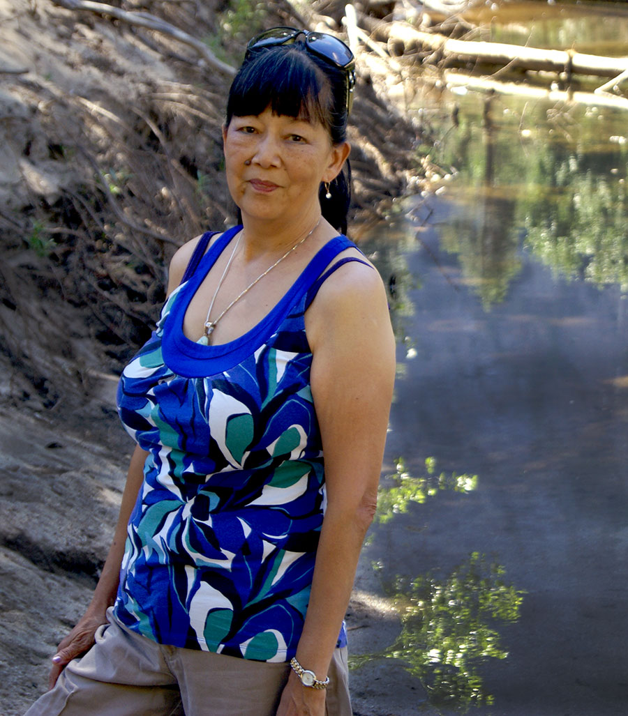 Kristina Ming standing by a creek